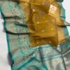 Brown And Teal Blue Border Exclusive Mashru Border Kora Banarasi Silk Saree