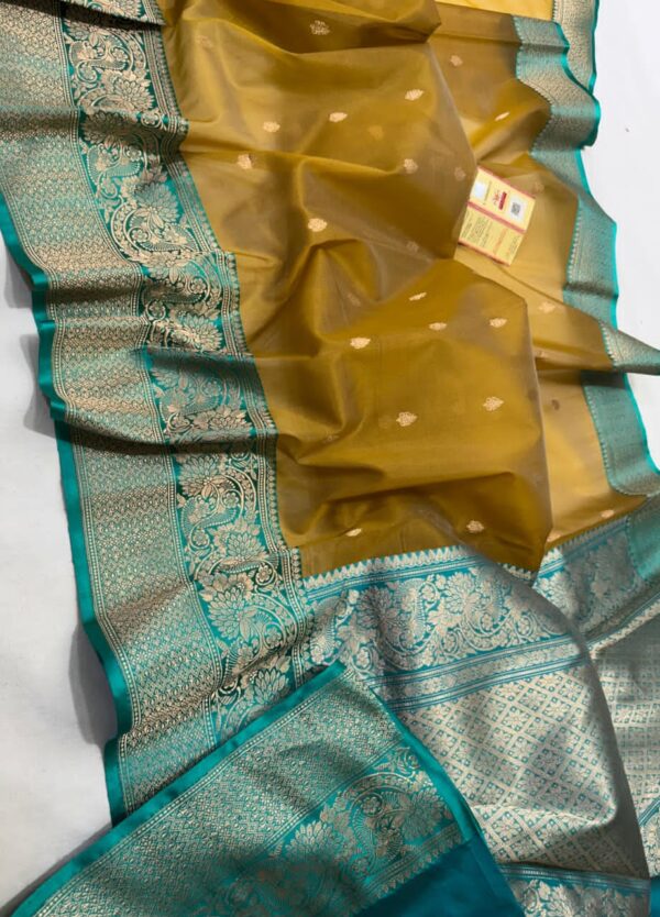 Brown And Teal Blue Border Exclusive Mashru Border Kora Banarasi Silk Saree