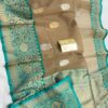 Light Brown And Turquoise Border Exclusive Mashru Border Kora Banarasi Silk Saree