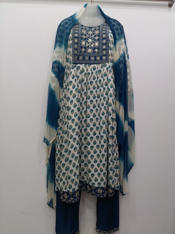 Blue and white readymade cotton frock suit with embroidered yoke, matching pants and printed dupatta for women.