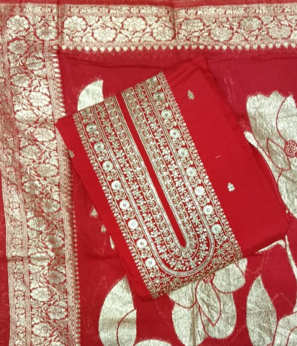 Red faux georgette semi stitched dress material featuring embroidered neckline and matching embroidered dupatta by Trends Designer Wear.